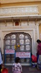 silver door of temple inside amber fort in jaipur