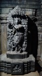 Idol of Krishna with broken flute (Left side) inside Keshava Temple in Somanathpur